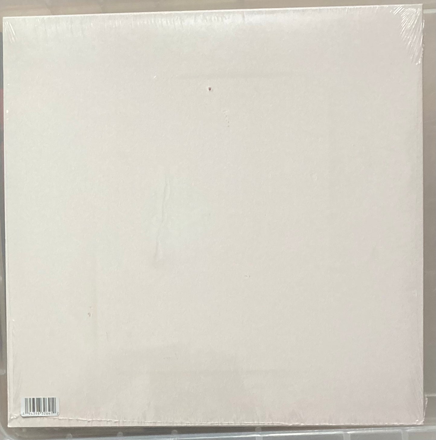 The back of 'Arcade Fire - Her' on vinyl