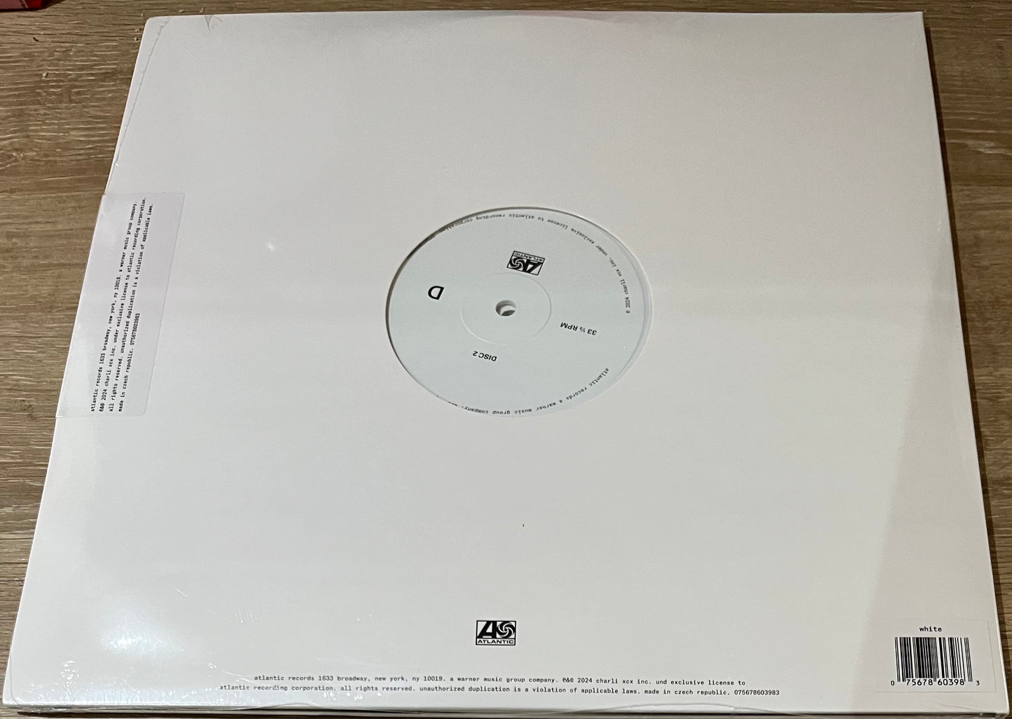 The back of 'Charli XCX Brat and it's the same but there's three more songs so it's not' on vinyl