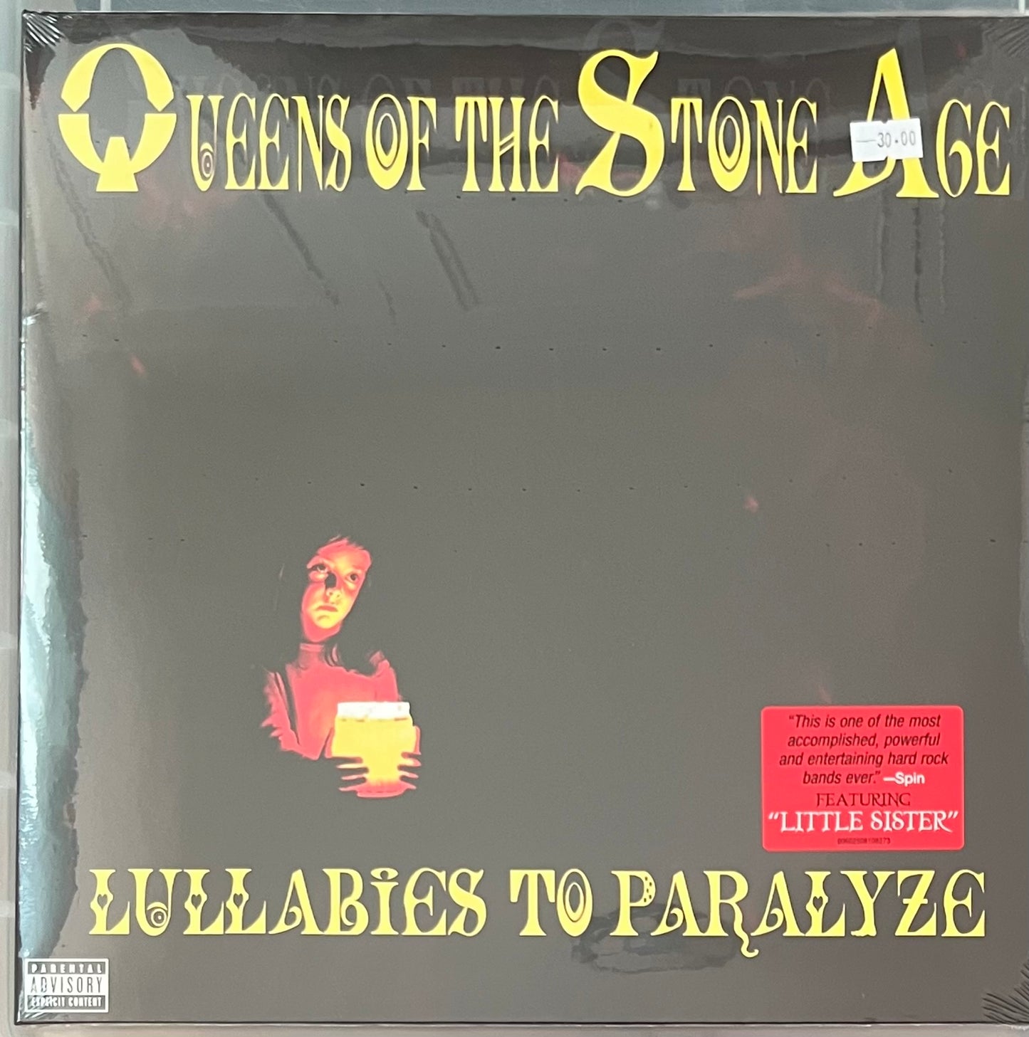 The front of ‘Queens of the Stone Age - Lullabies to Paralyze’ on vinyl