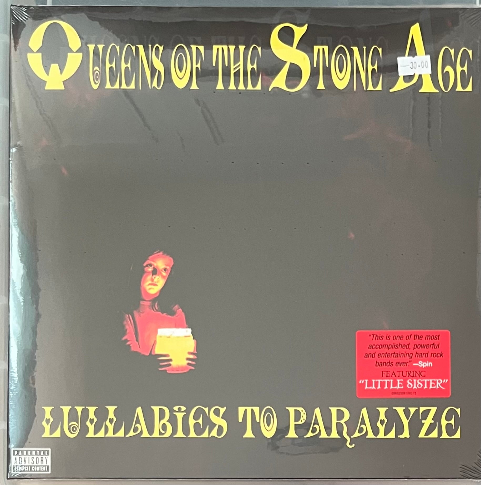 The front of ‘Queens of the Stone Age - Lullabies to Paralyze’ on vinyl