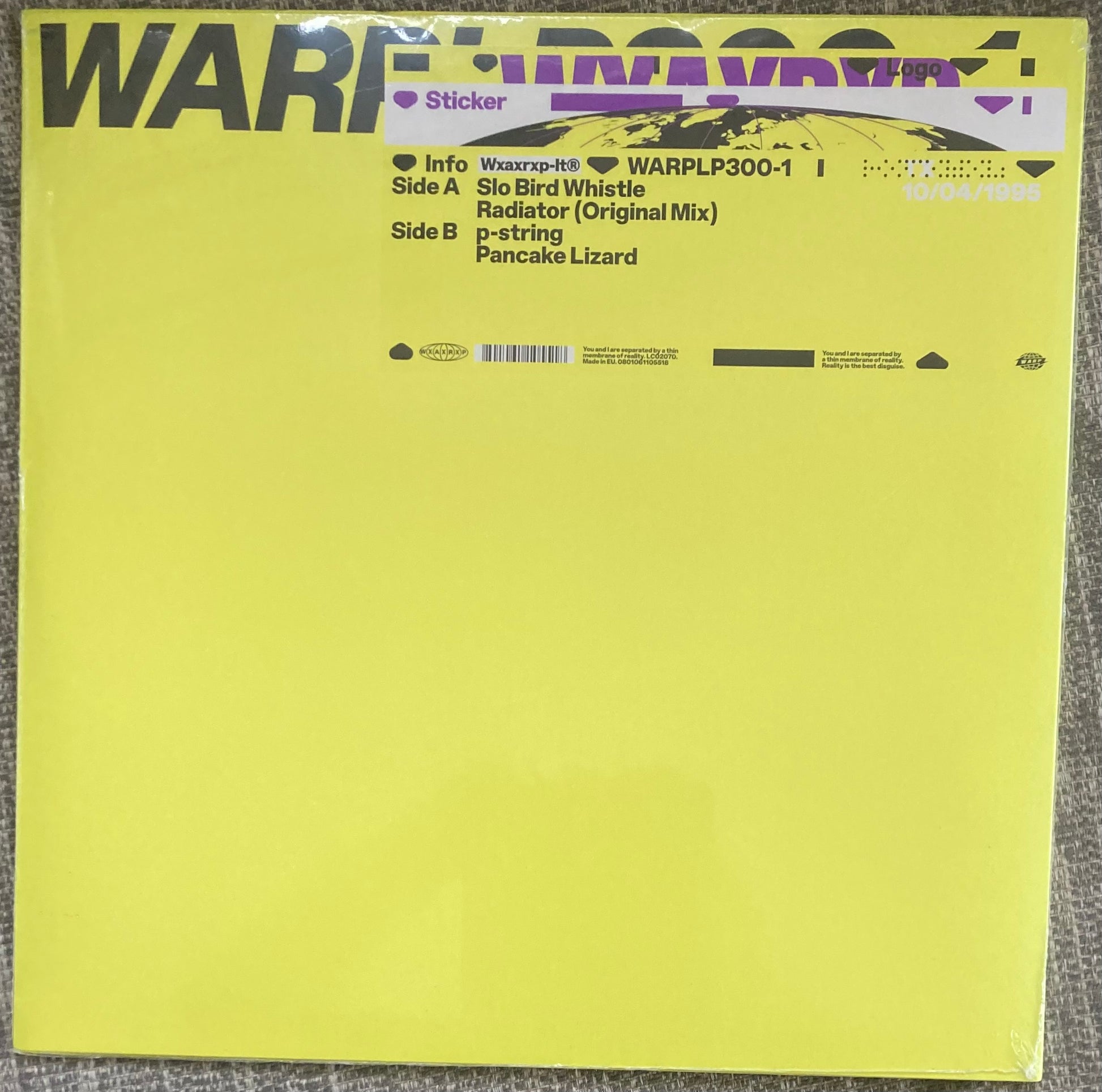 The back of 'Aphex Twin - WARPLP300-1' on vinyl