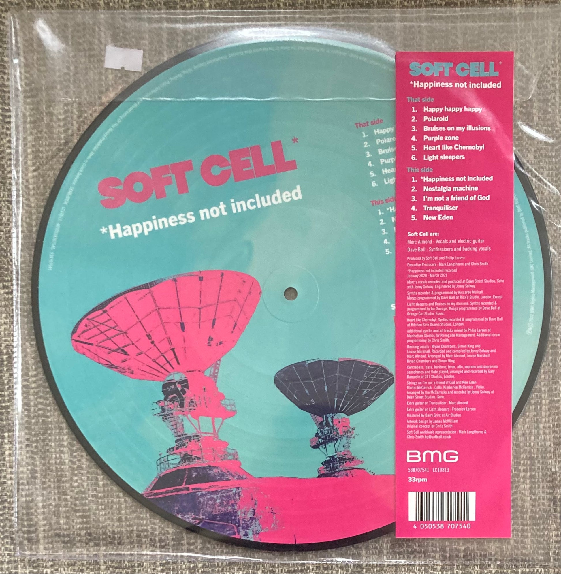 The back of 'Soft Cell - *Happiness Not Included' on vinyl. It is a picture disc