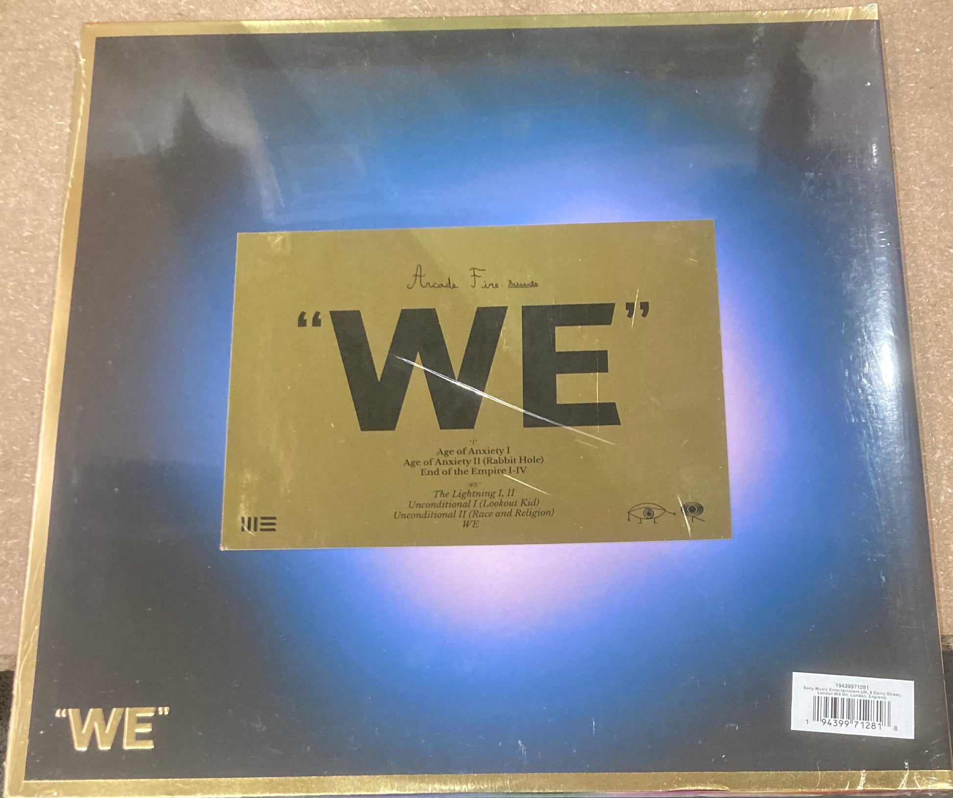 The back of 'Arcade Fire - We' on vinyl