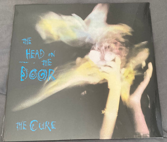 The front of 'The Cure - Head on the Door' on vinyl