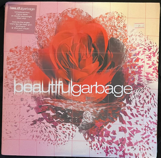 Album cover with a stylized rose and 'beautifulgarbage' text on a patterned background