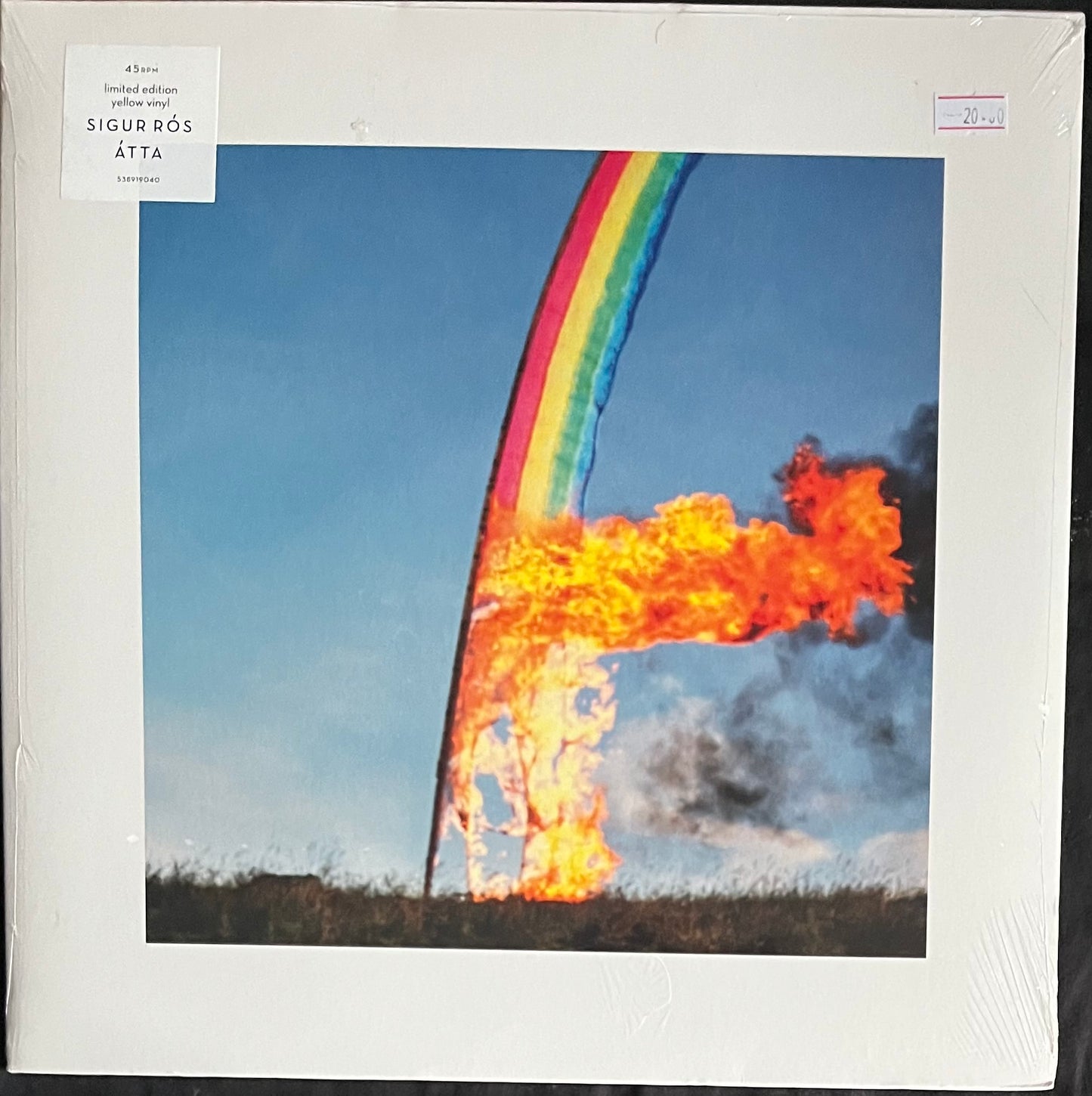 Vinyl record cover with a rainbow and fire design, featuring the text 'Sigur Rós Átta'.