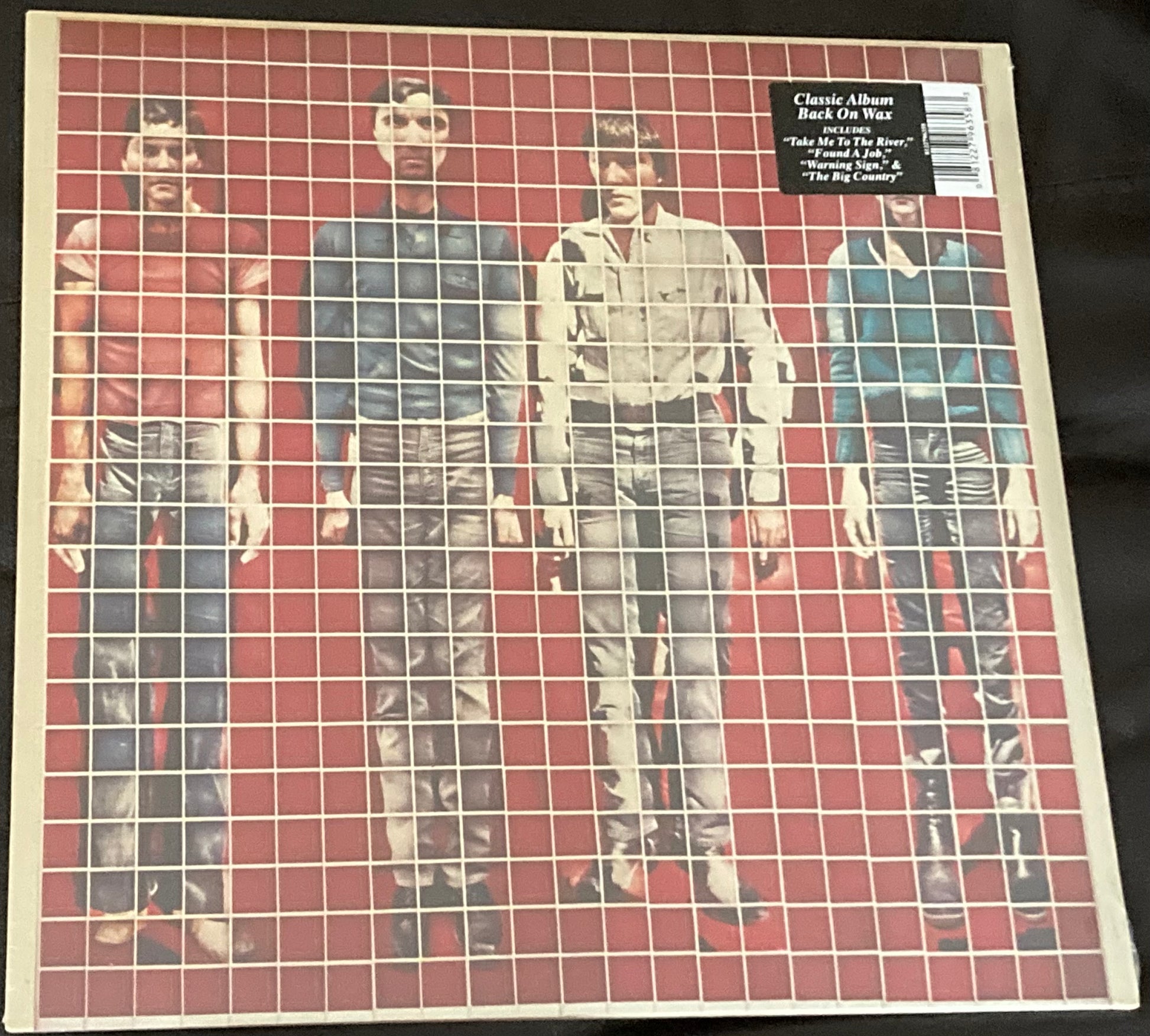 The front of 'Talking Heads - More Songs About Buildings and Food' on vinyl