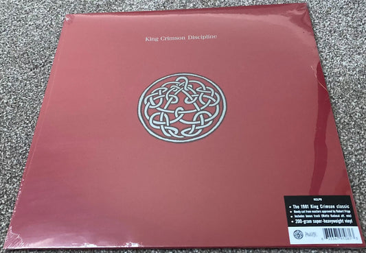 The front of ‘King Crimson - Discipline’ on vinyl.