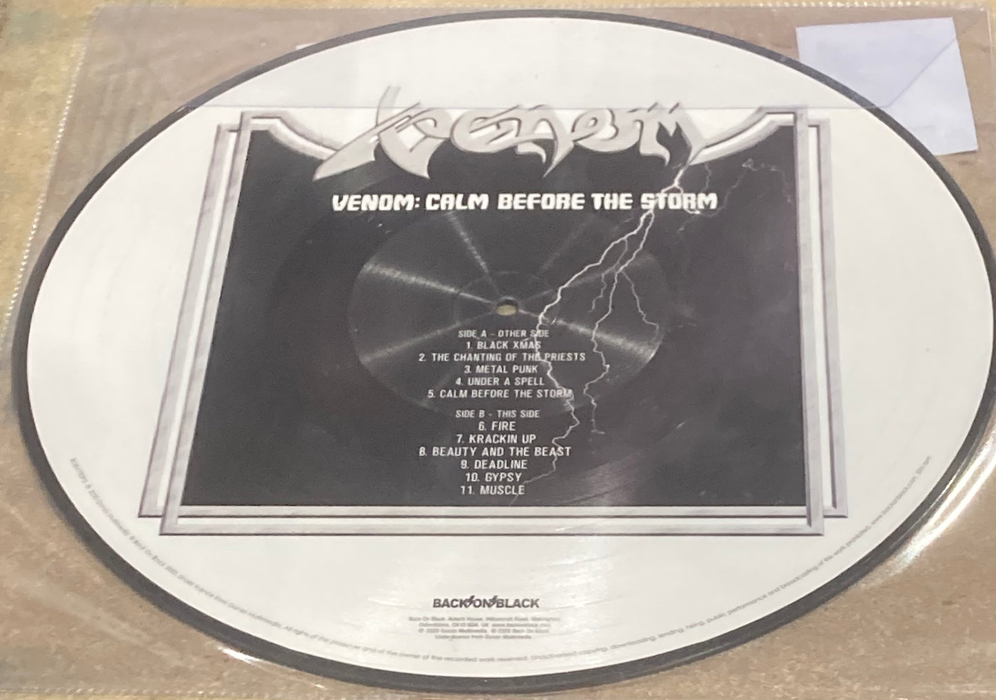 The back of Venom - Calm Before the Storm on vinyl. 