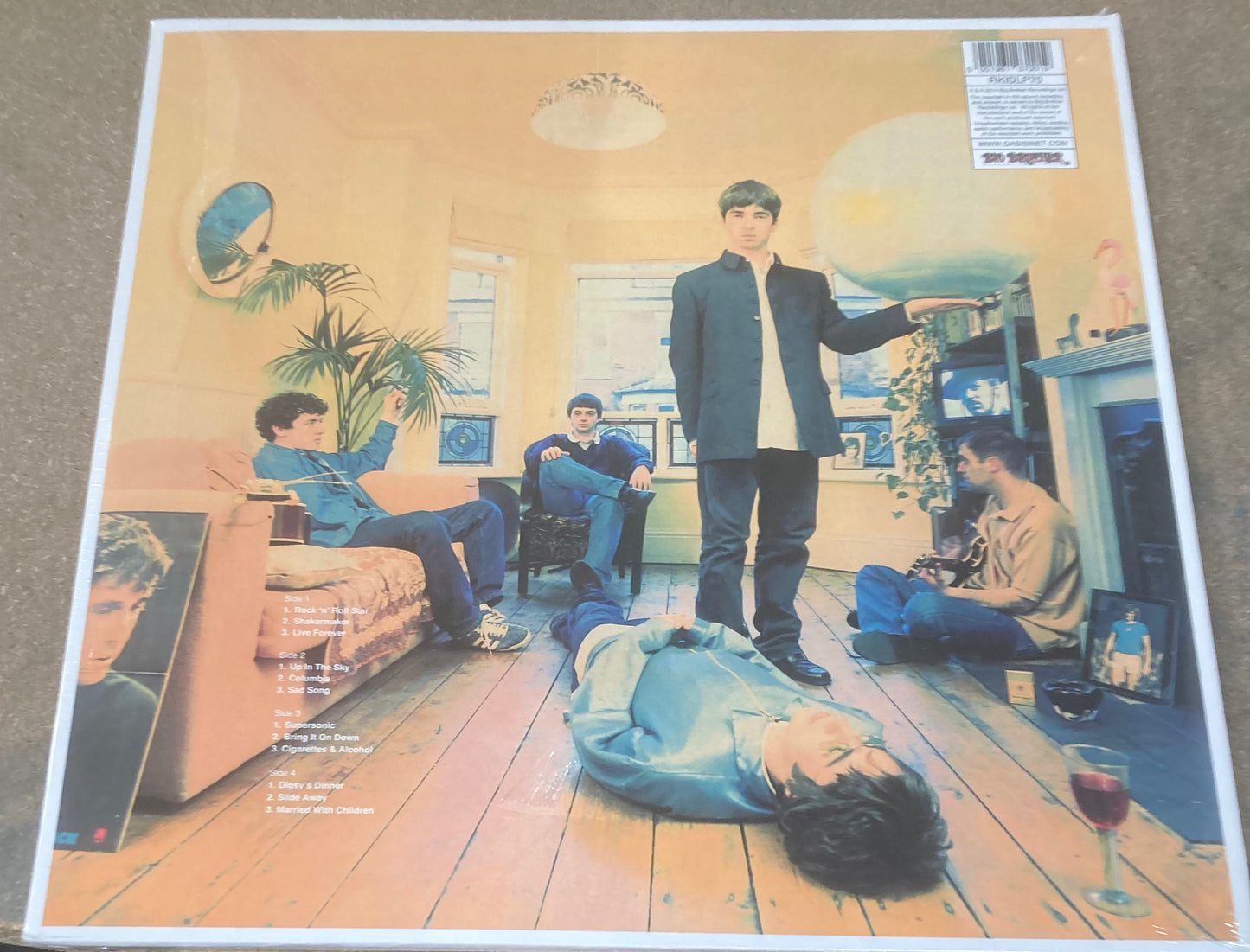 The back of ‘Oasis - Definitely Maybe’ on vinyl