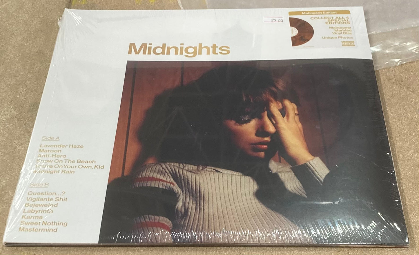 The front of 'Taylor Swift - Midnights' on vinyl. This is the mahogany edition